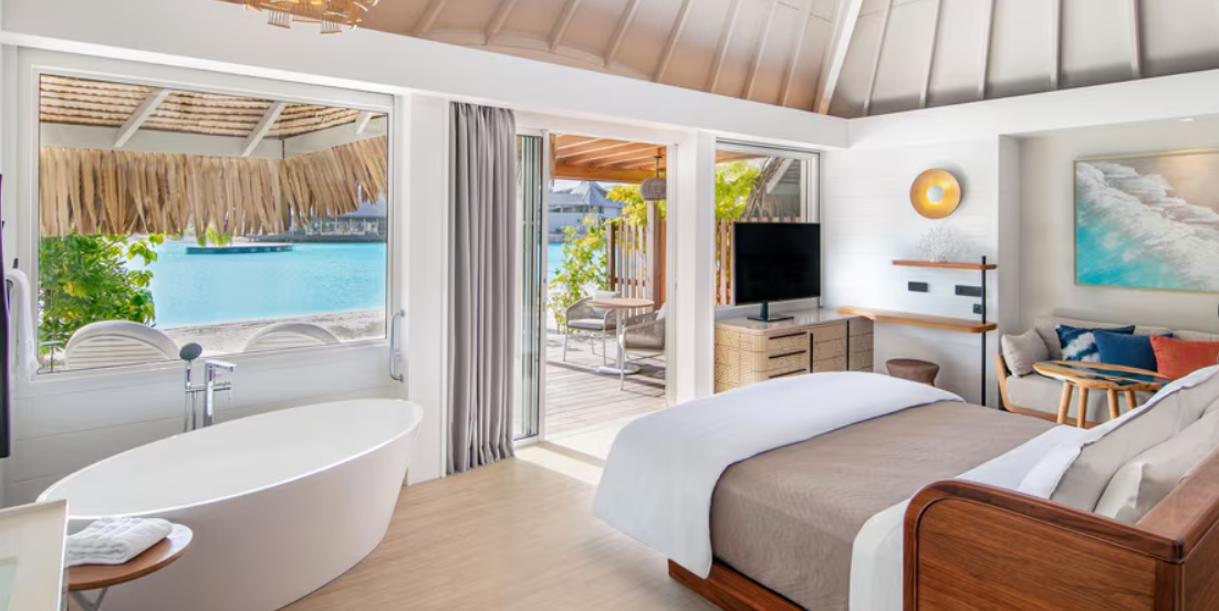 Bedroom with king Heavenly Bed, freestanding tub and lagoon views in the Westin Bora Bora 2 Bedroom Beach Villa