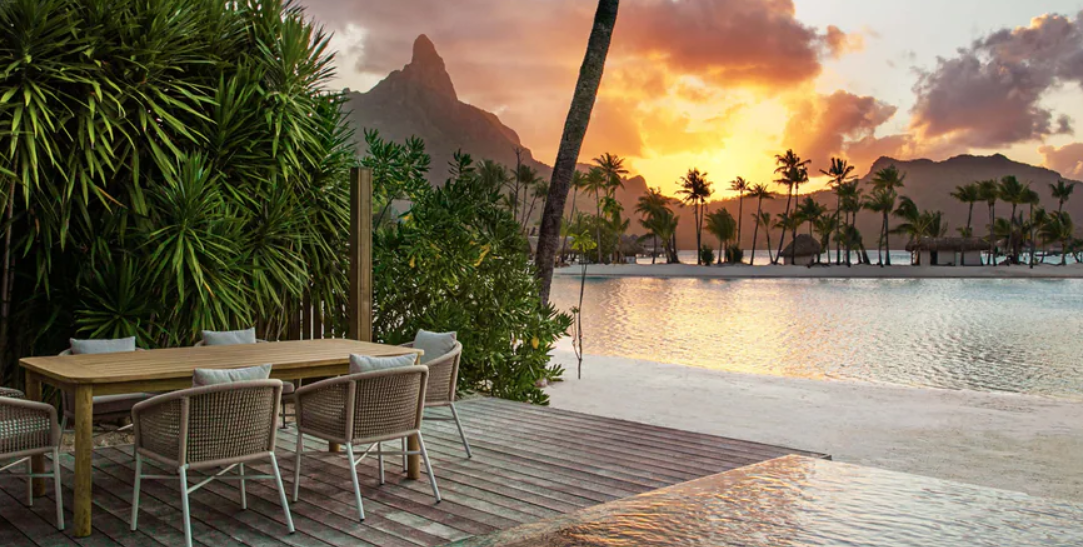 Outdoor dining terrace at sunset with Mount Otemanu views from the Westin Bora Bora 2 Bedroom Beach Villa