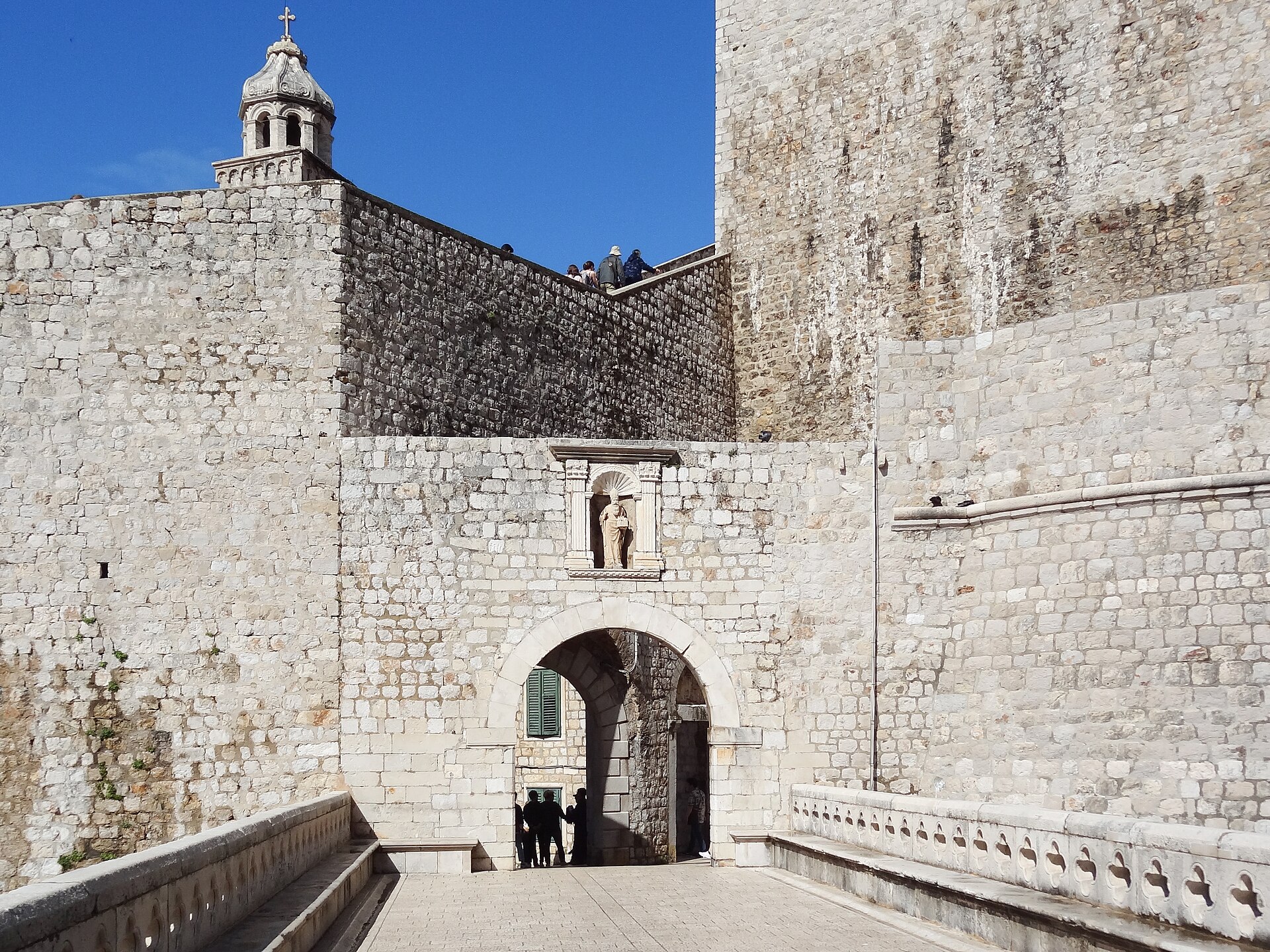 Stone bridge and arch of Ploče Gate, the east entrance to Dubrovnik's Old Town