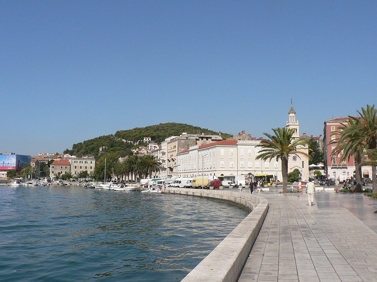 Split's waterfront, with boats along the quay and Marjan hill behind the town