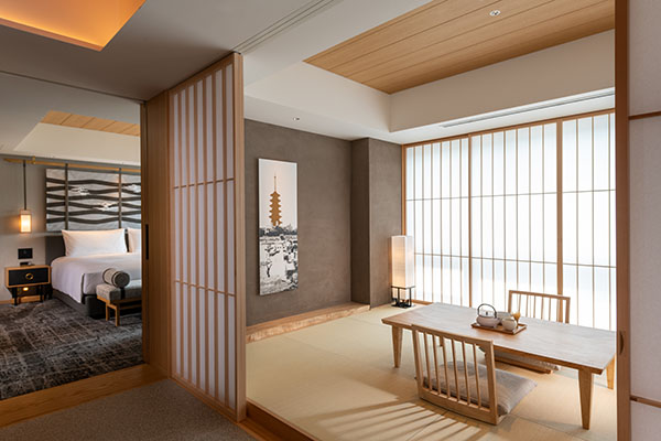King Kyoto Suite with a tatami tea table and the bedroom visible past a wood screen