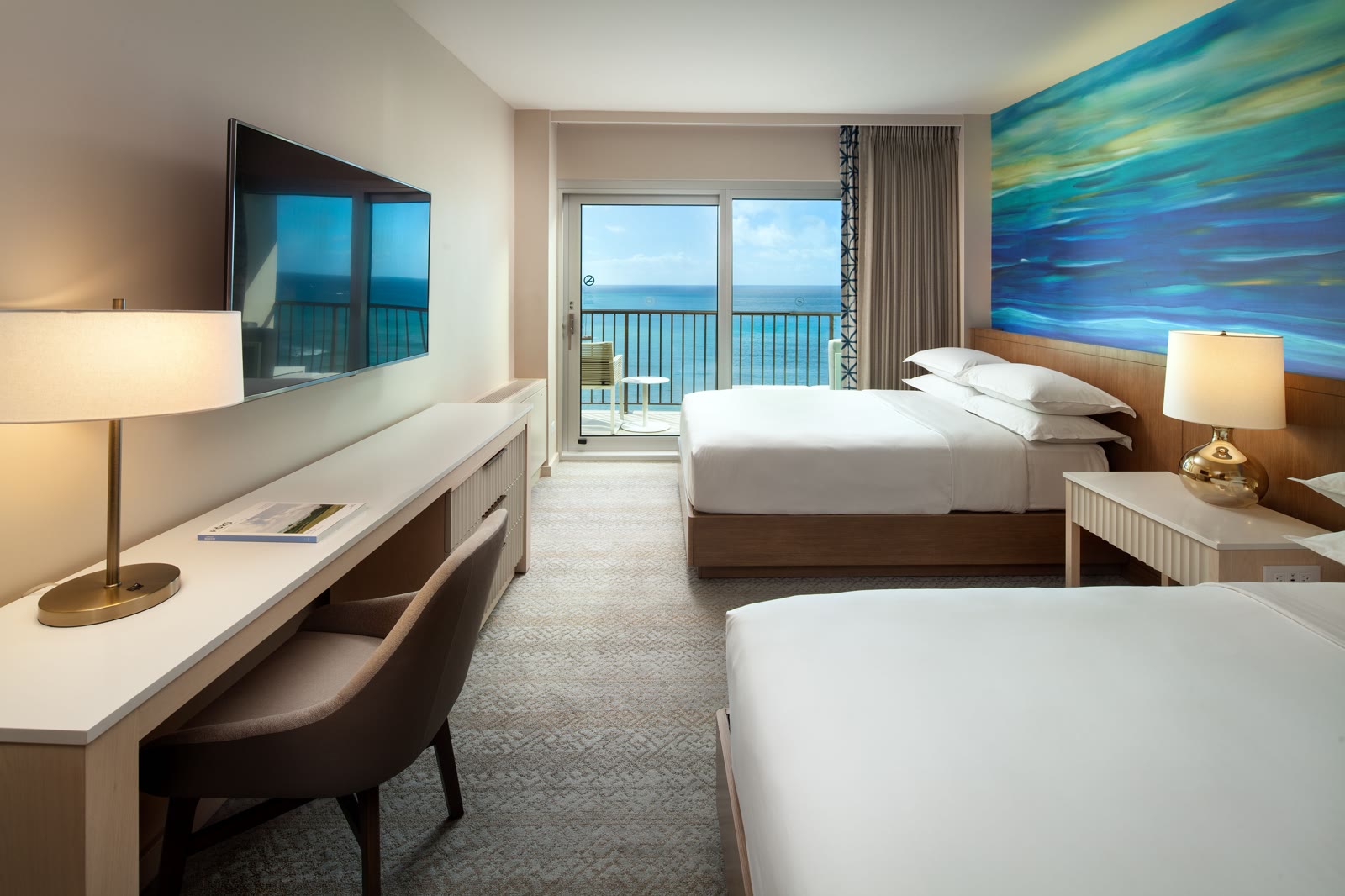 Sheraton Waikiki oceanfront room with two queen beds and an ocean lanai
