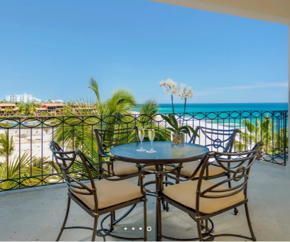 Dreams Los Cabos Family Junior Suite Ocean View private balcony with table overlooking the beach and Sea of Cortez