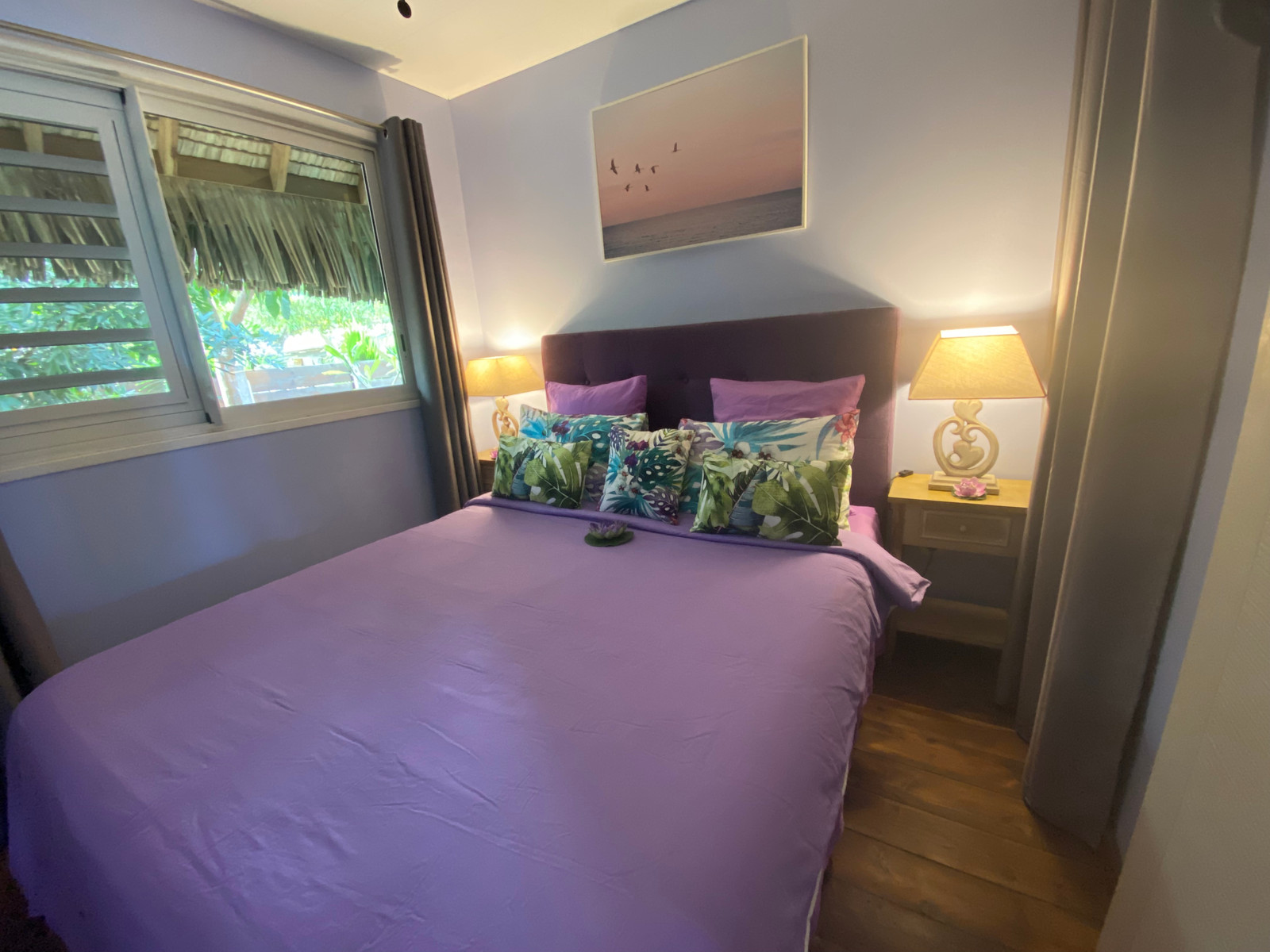 Fare Oaoa Haapiti Beachfront Bungalow bedroom with queen bed