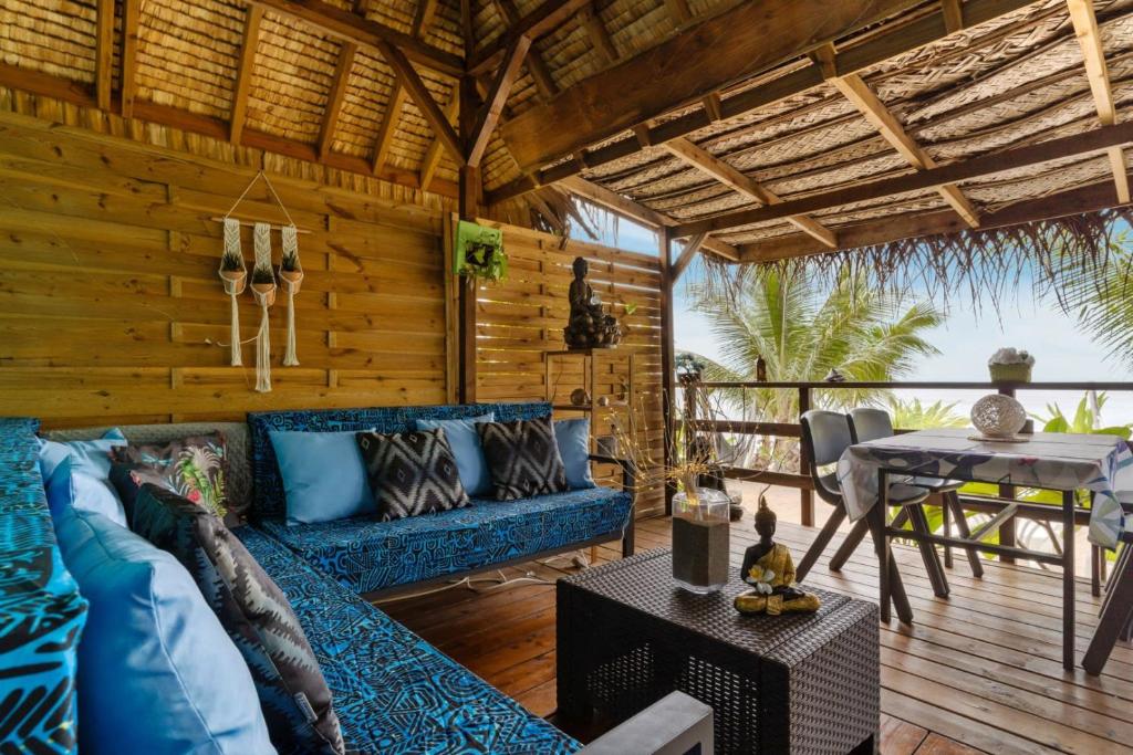 Fare Oaoa Haapiti Beachfront Bungalow open-air patio lounge