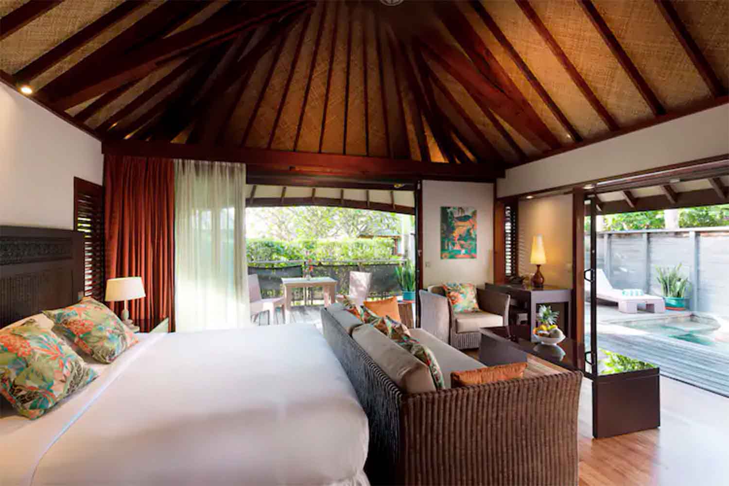 Hilton Moorea Deluxe Garden Pool Villa bedroom opening to private plunge pool
