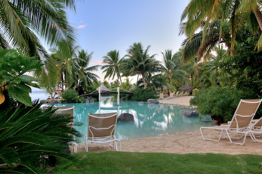 InterContinental Tahiti lagoon-style resort pool surrounded by palms