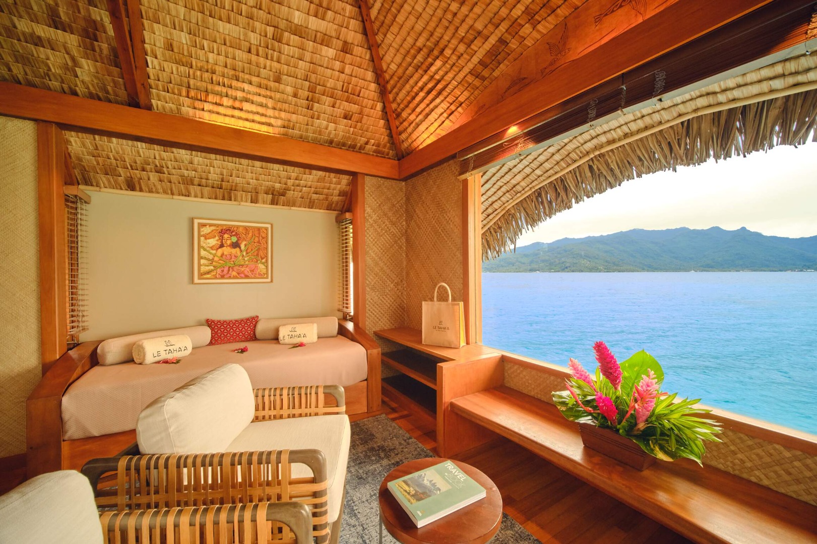 Le Taha'a Overwater Suite sitting area with lagoon views
