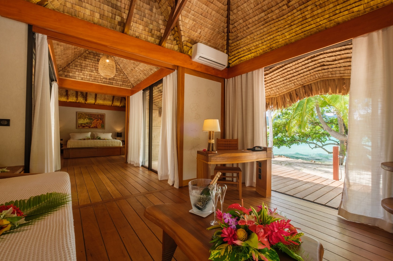 Le Taha'a Pool Beach Villa living area with lagoon view