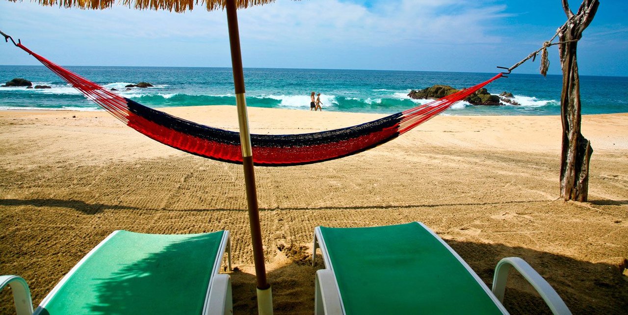 Private beach lounge chairs and hammock at Playa Escondida Sayulita