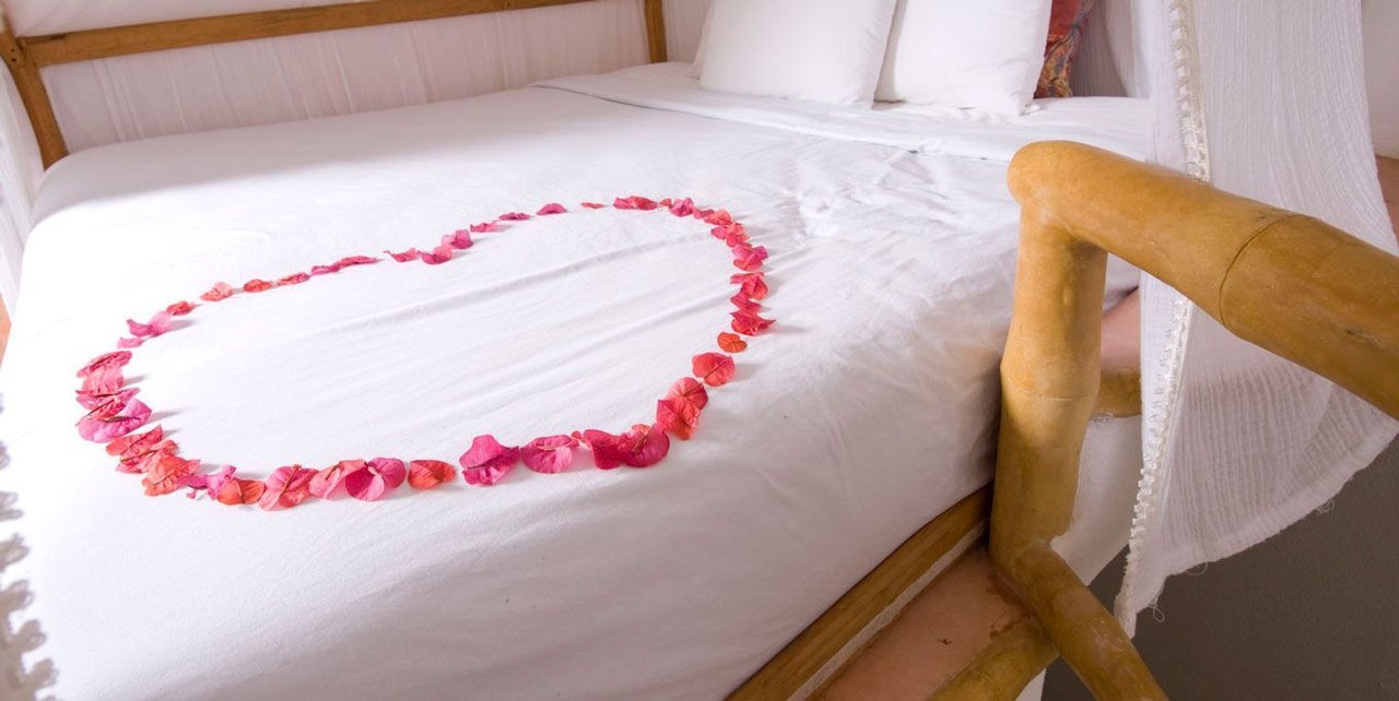 Romantic Beachfront Luna suite bedroom at Playa Escondida