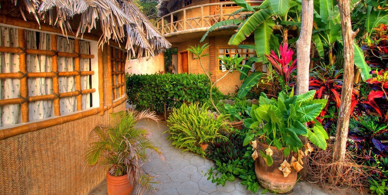 Thatched Beachfront Villa casitas along the path at Playa Escondida