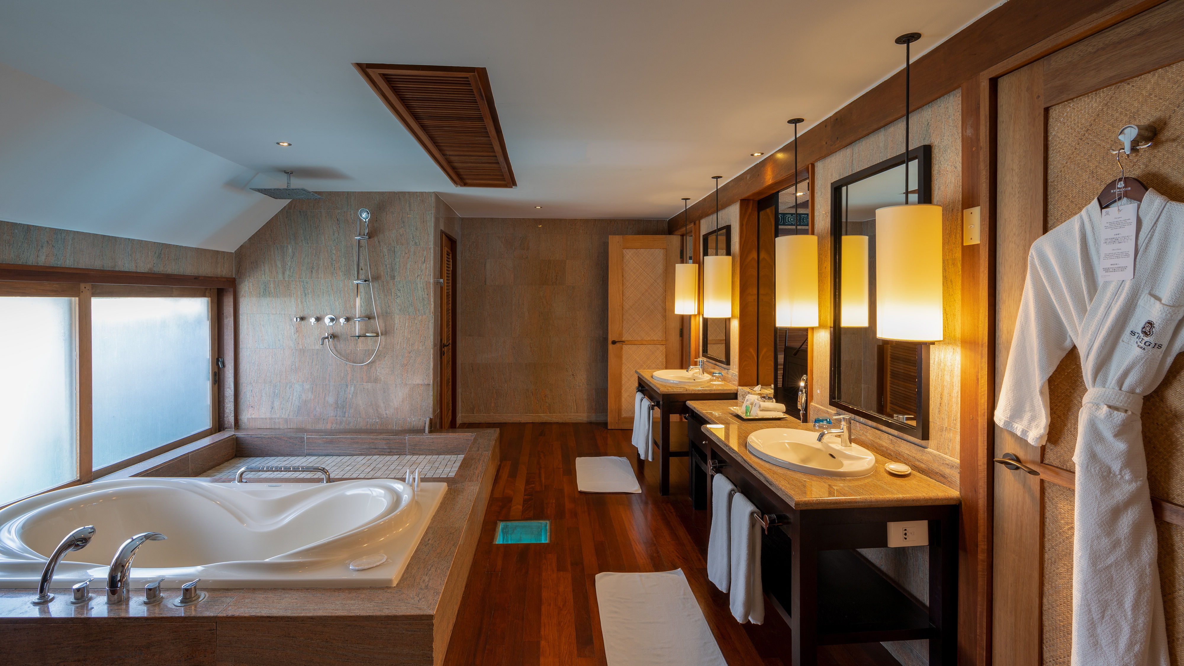 St Regis Bora Bora Superior Overwater Villa marble bathroom with soaking tub