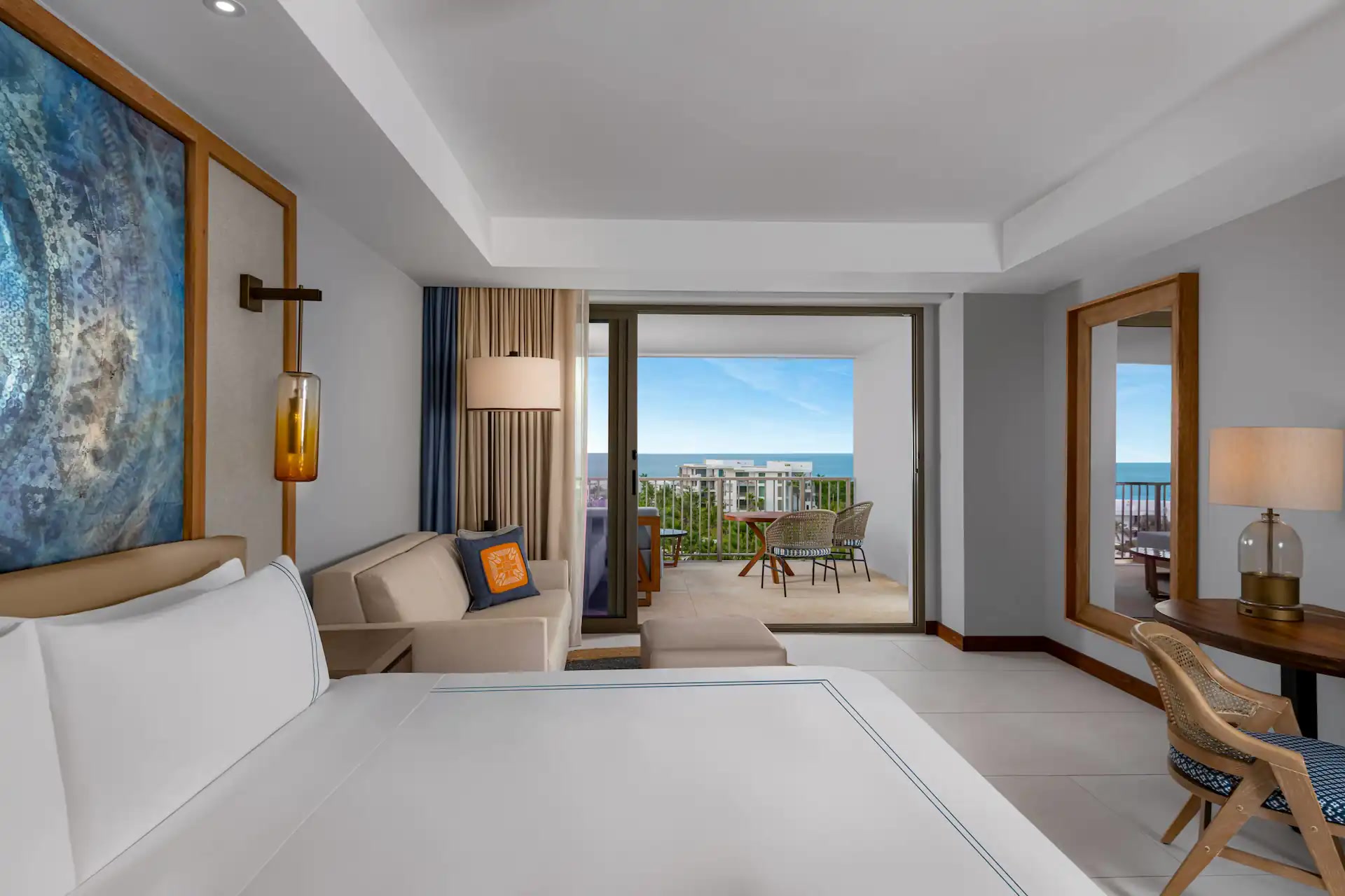 Conrad Punta de Mita Ocean View King Room seating and balcony doors