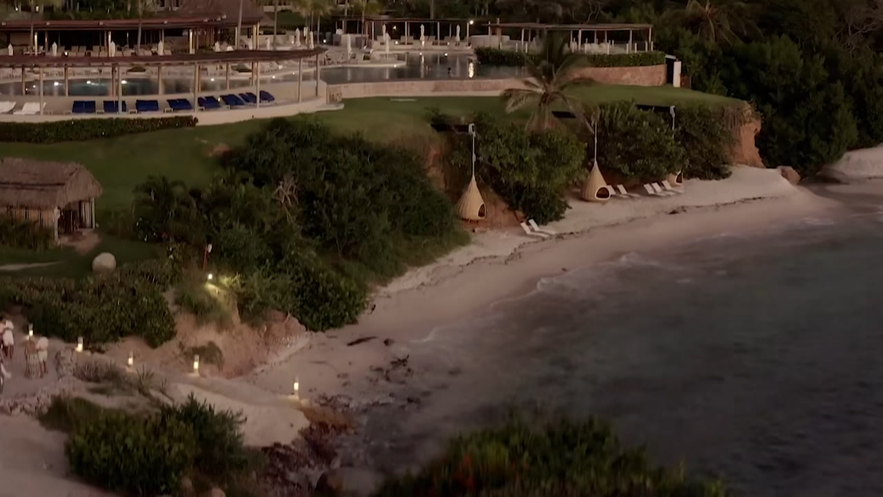 White-sand beach and hanging lounges at Four Seasons Resort Punta Mita