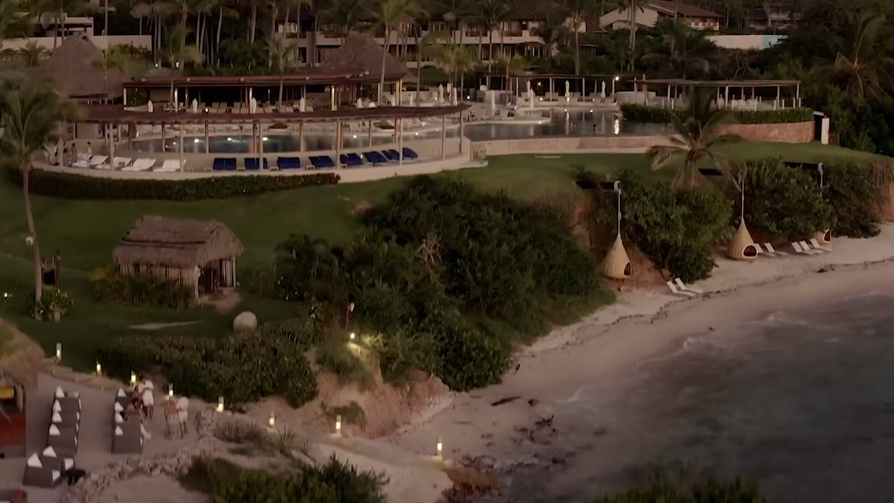 Infinity pool and thatched pavilion at Four Seasons Resort Punta Mita