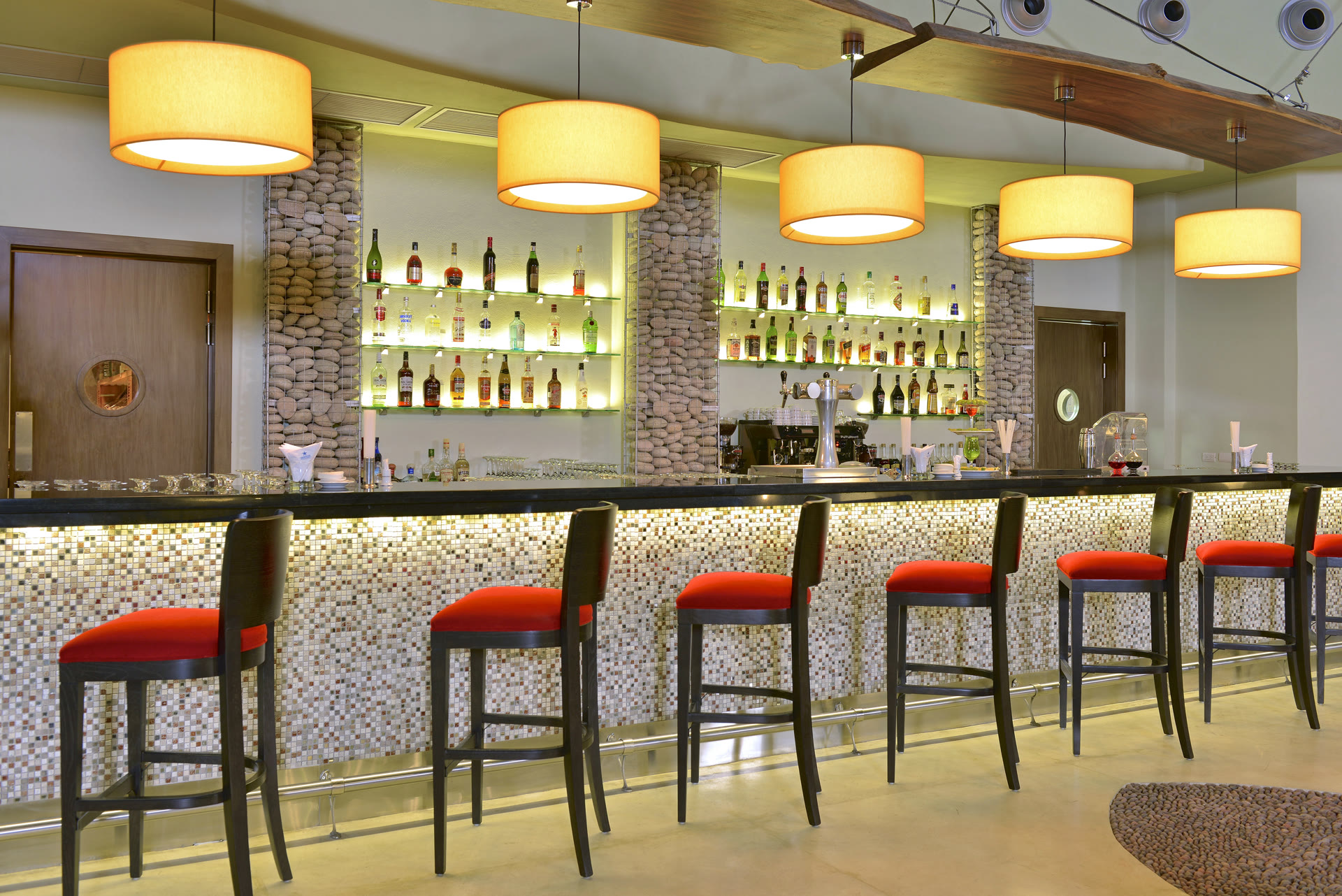 Lobby bar with red stools at Iberostar Selection Playa Mita