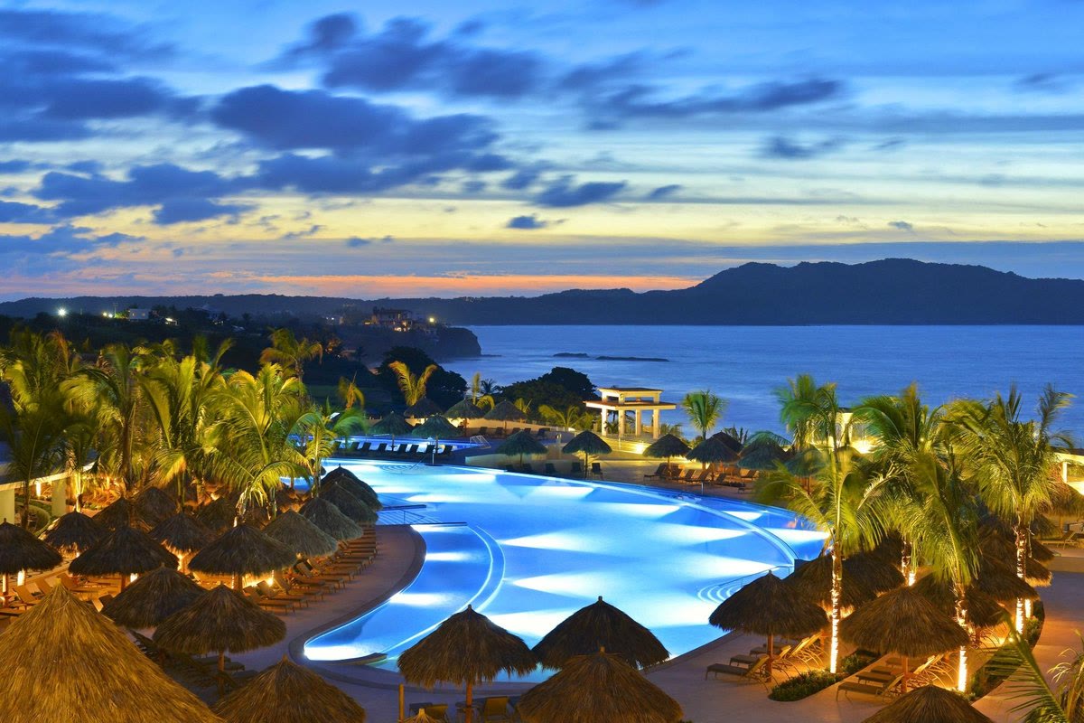 Pool and ocean sunset at Iberostar Selection Playa Mita