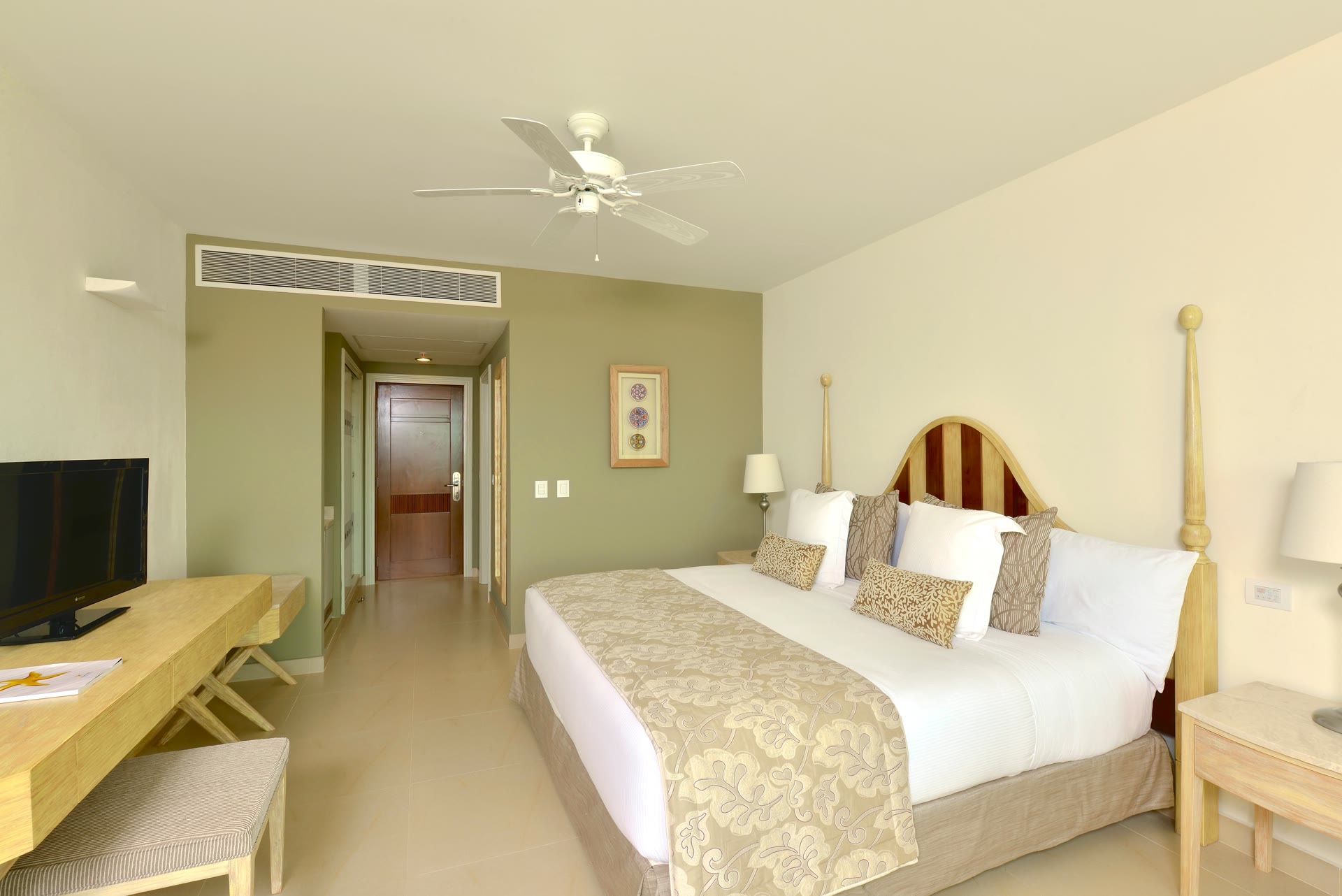 King guest room with wood headboard at Iberostar Selection Playa Mita