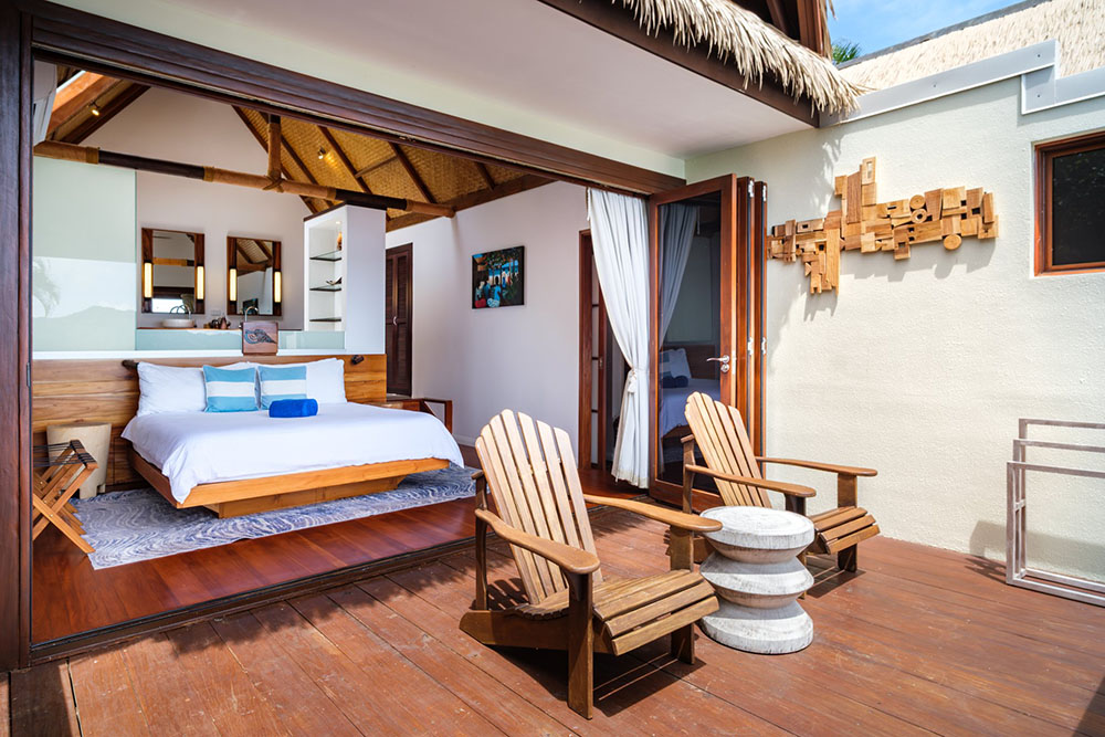 Royal Davui Lagoon Plunge Pool Bungalow bedroom opening to the deck