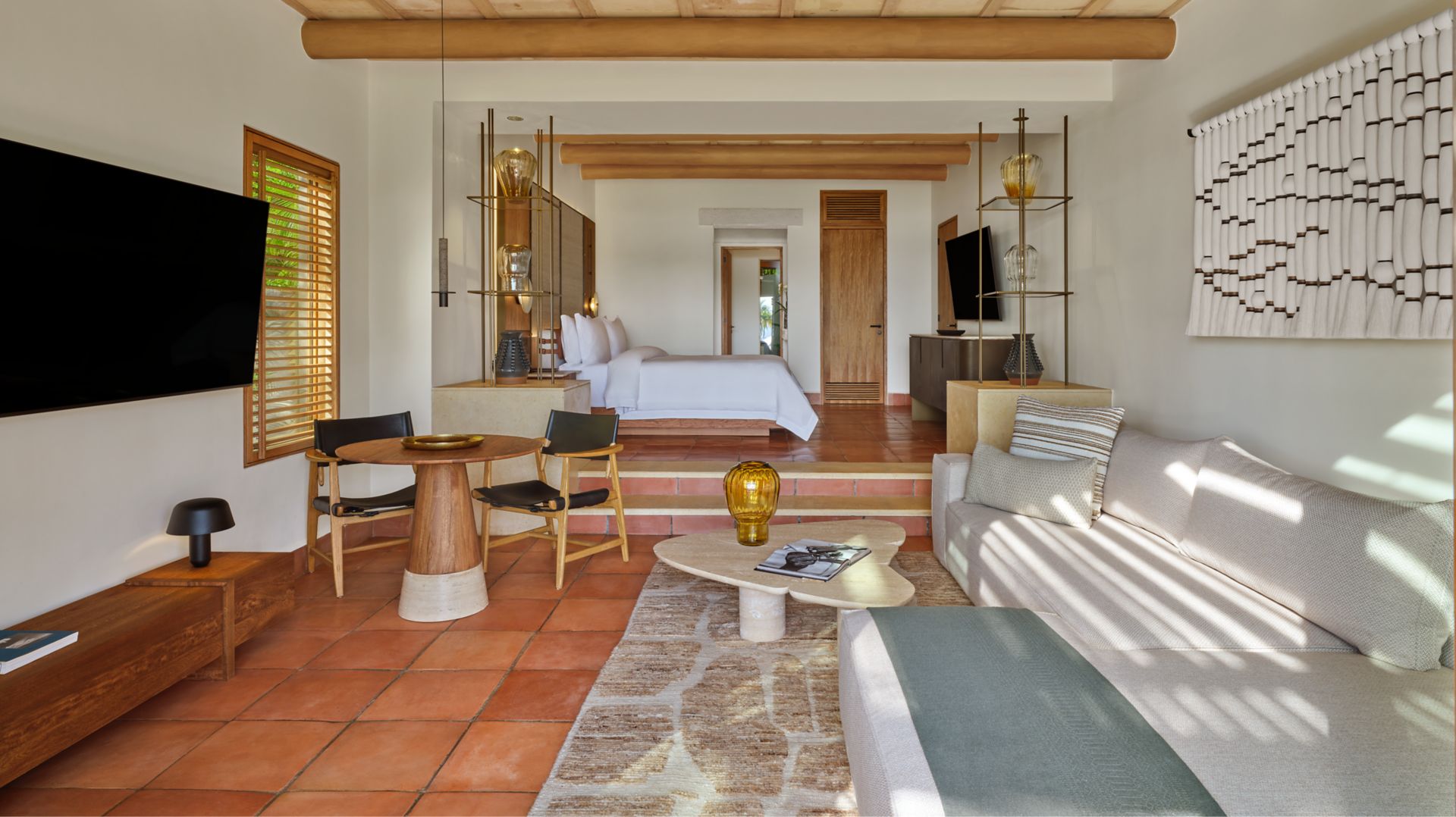 Junior Suite with separate seating area and king bed at The St. Regis Punta Mita