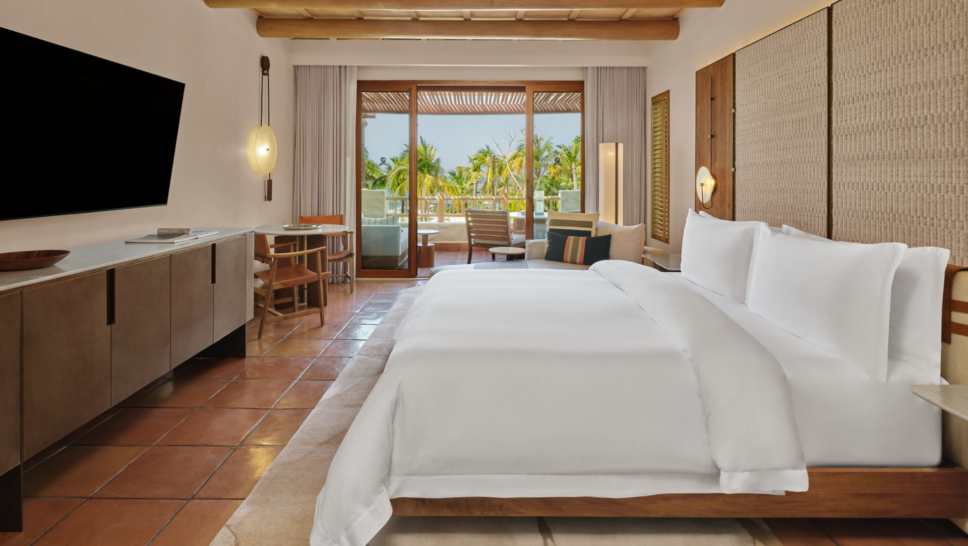 Casita Ocean View King bedroom with soft lighting at The St. Regis Punta Mita