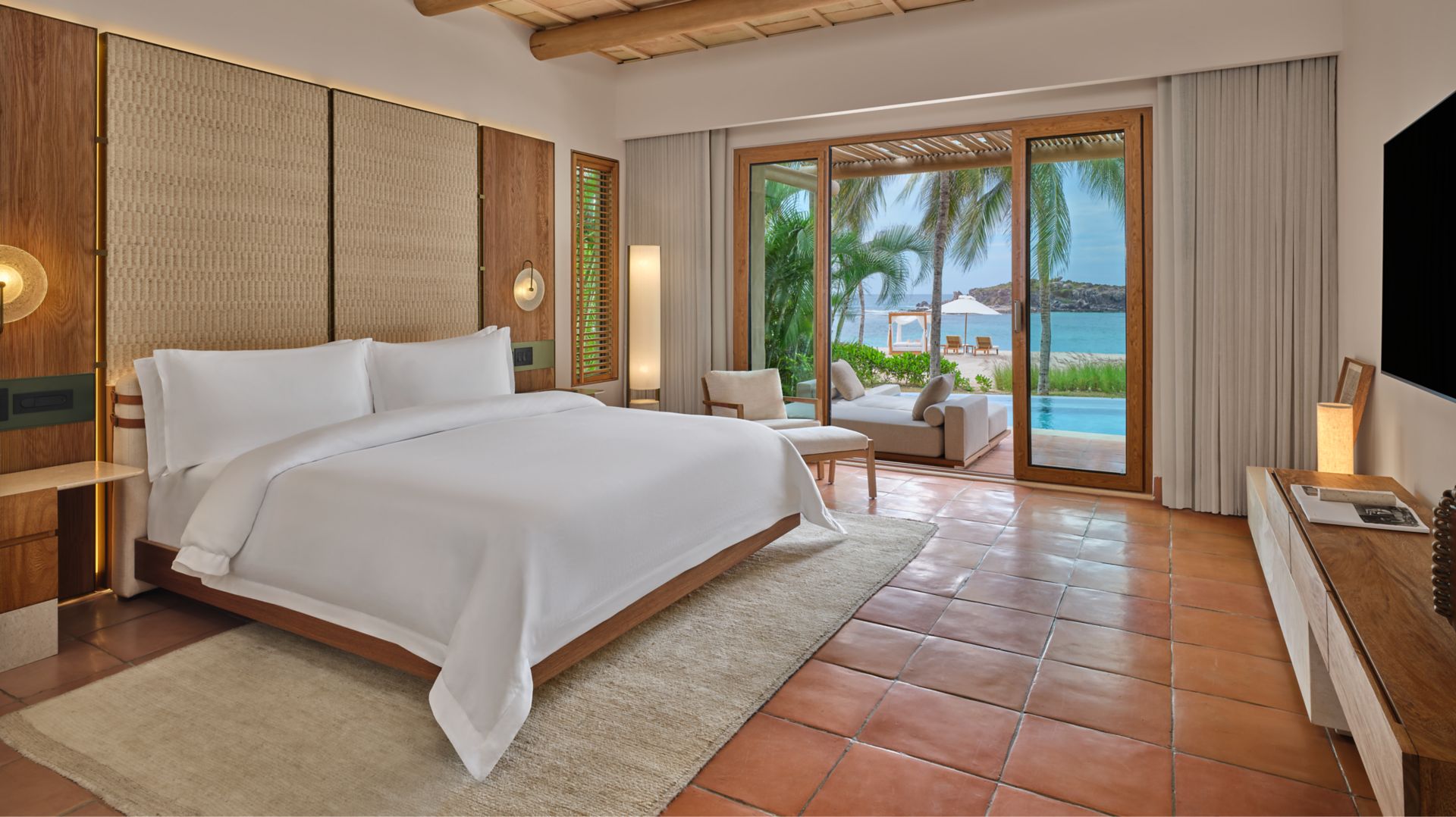 One-Bedroom Villa living room opening to a private plunge pool at The St. Regis Punta Mita