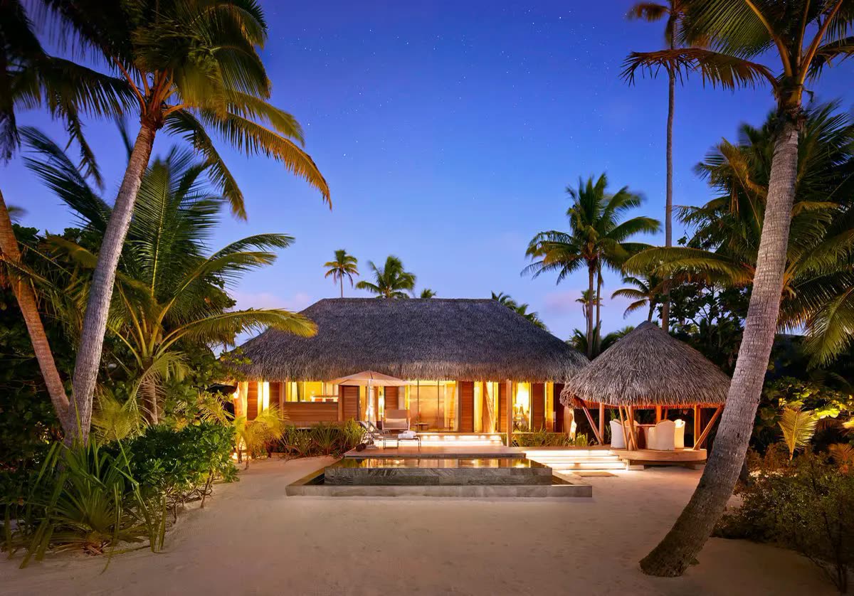 The Brando One Bedroom Villa exterior at twilight on Tetiaroa