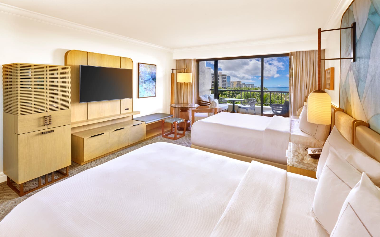 Aliʻi Tower partial ocean view room with two queen beds