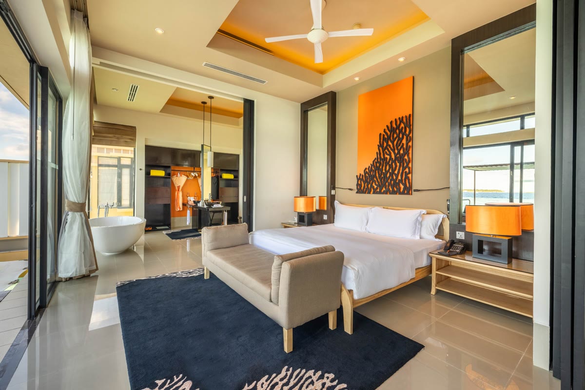 InOcean Pool Villa bedroom at Angsana Velavaru, the overwater pool villa