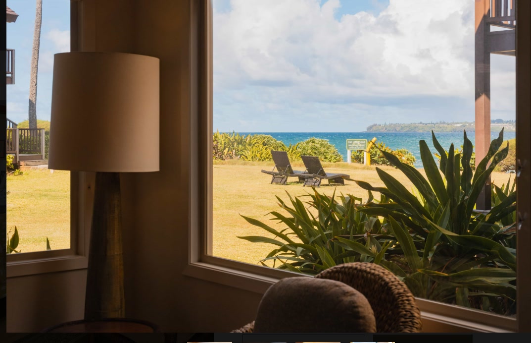 Oceanfront suite window looking out to the beach at Hanalei Colony Resort, Kauai