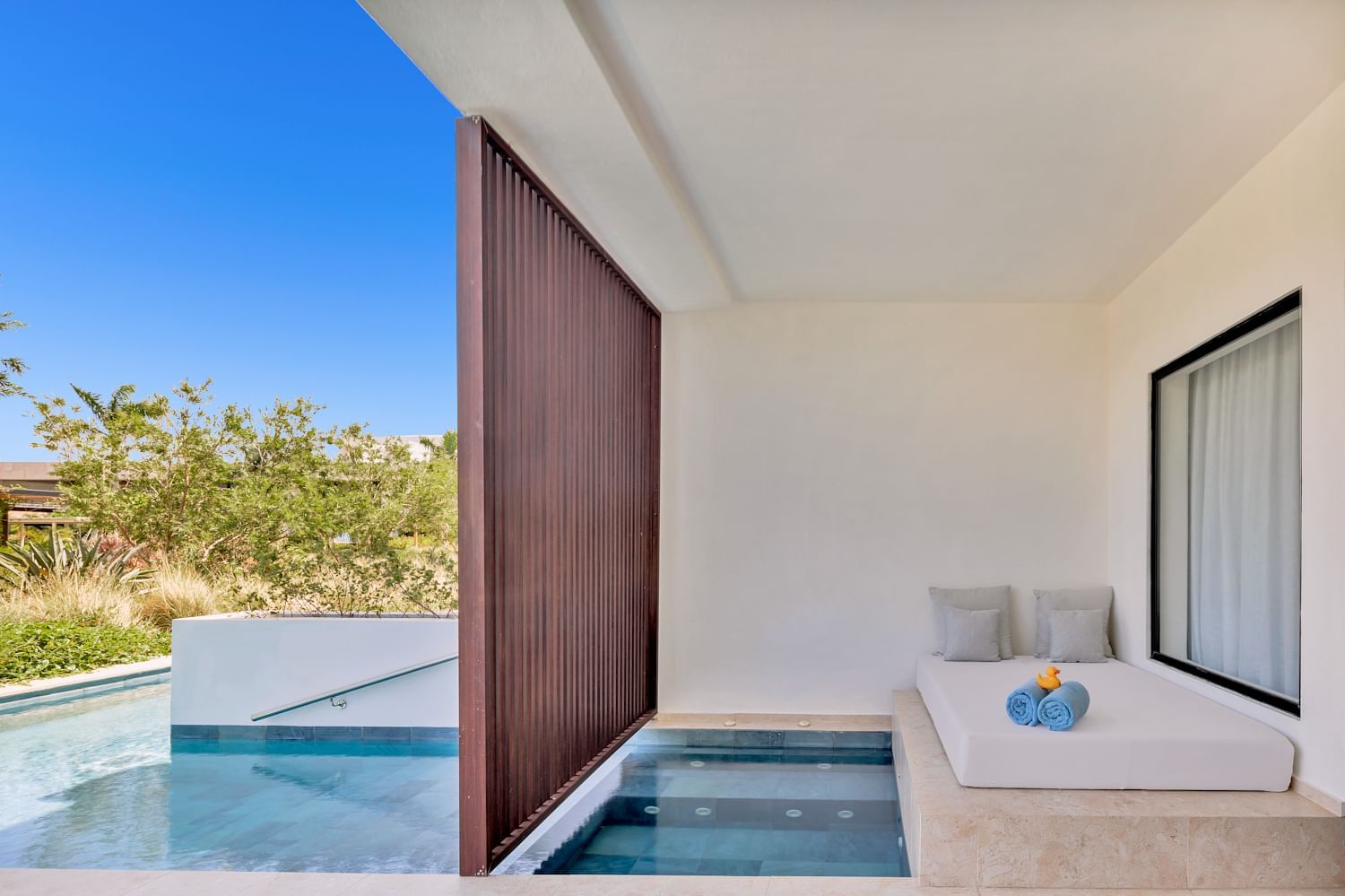 Swim-up terrace daybed and pool at Live Aqua Punta Cana