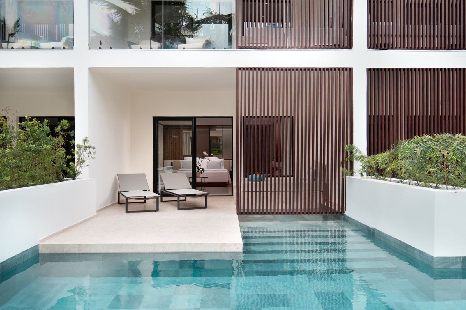 Aqua Junior Suite Swim-Up with king bed and pool access at Live Aqua Punta Cana