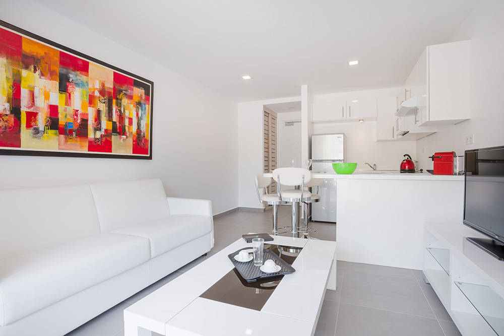Garden Suite living space opening to the terrace at Residence Moorea Sunset Beach