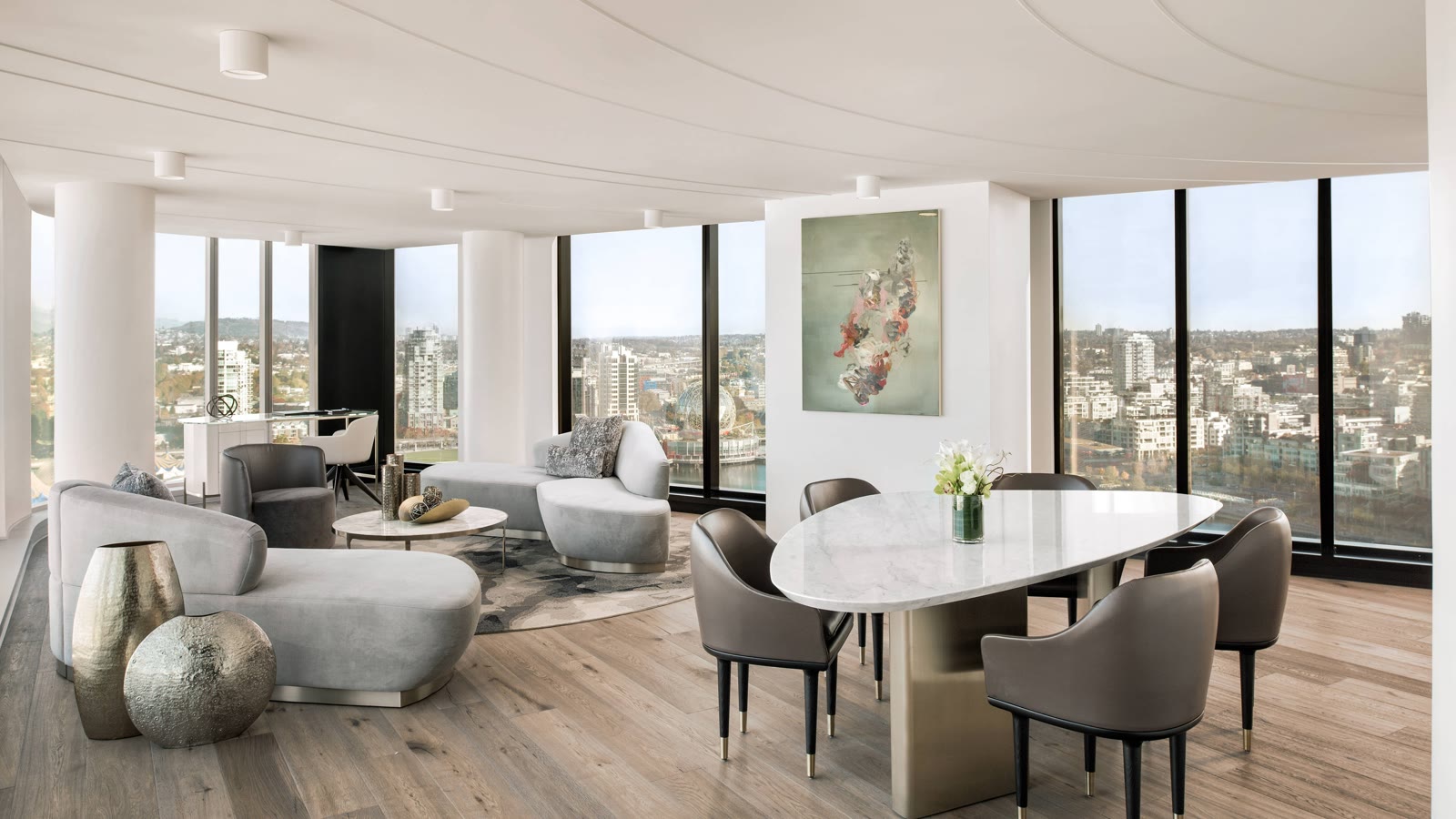 Sky Suite living area at JW Marriott Parq Vancouver, wrapped in windows