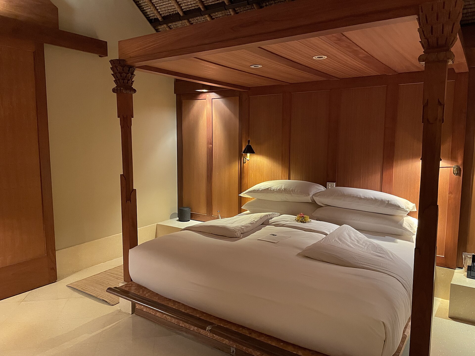Wood four-poster bedroom in a suite at Amankila, Karangasem, Bali