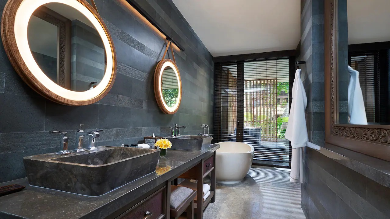 Bathroom with a rain shower in a Deluxe Room at Andaz Bali