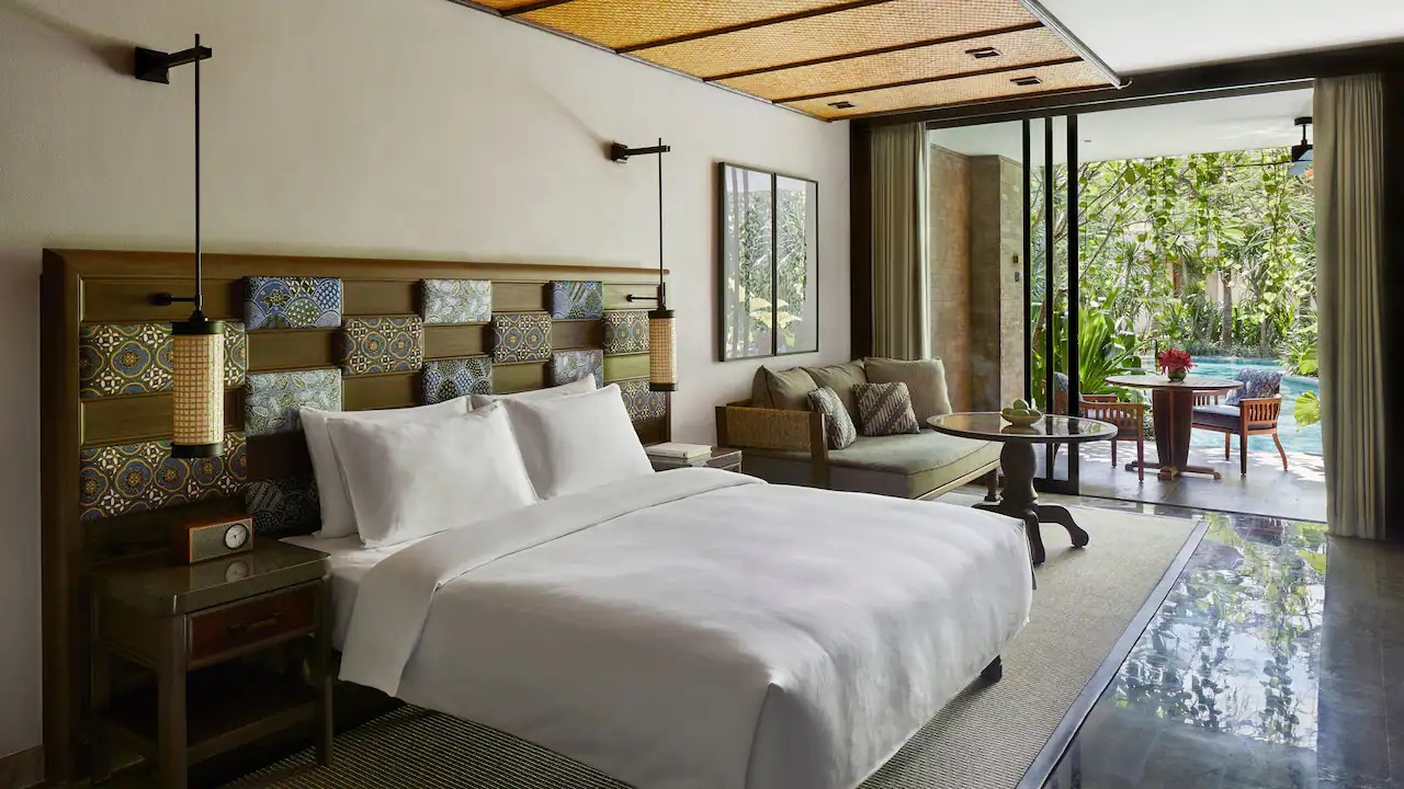 King bed in a Lagoon Access Room at Andaz Bali