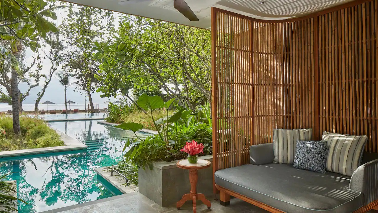 Terrace of the Ocean View Lagoon Suite overlooking the lagoon and ocean at Andaz Bali
