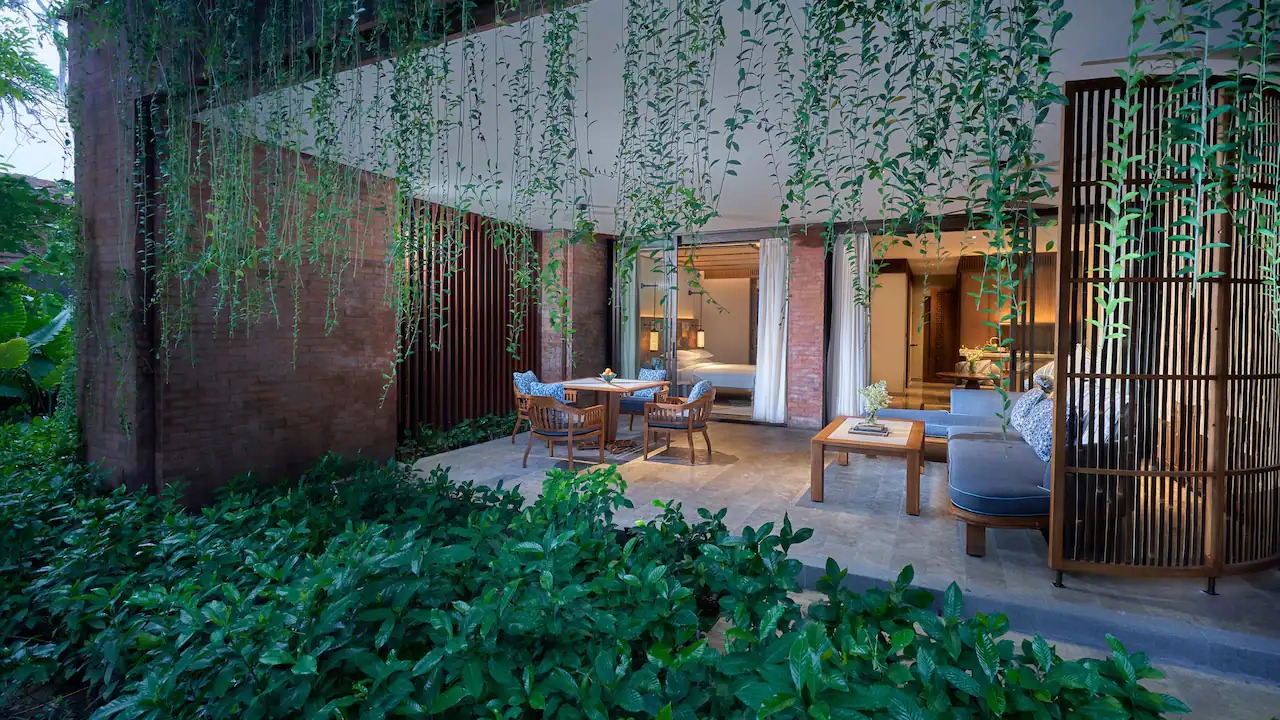 Oversized balcony of a Premium Room overlooking the garden and pool at Andaz Bali