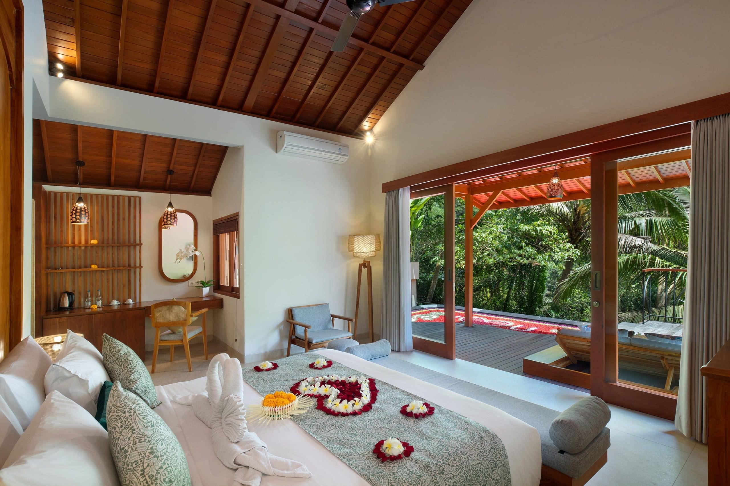 Canopied bedroom opening to the terrace of a One-Bedroom Pool Villa at Jannata Ubud